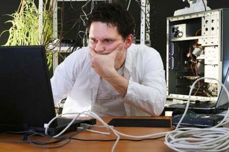 4708691-man-thinking-about-problems-on-computer-in-the-repair-plant